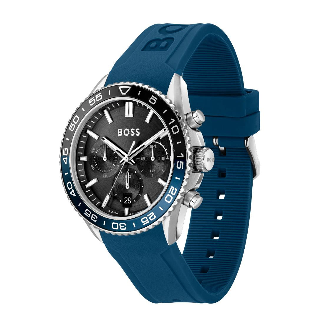 A Hugo Boss men's watch featuring a dark blue silicone strap, a black dial with silver-tone subdials and markers, and a silver-tone stainless steel case with a blue bezel.