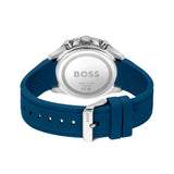 The back view of a HUGO BOSS watch with a blue silicone strap and a silver stainless steel case, showing the branded silver back plate.