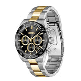 A Hugo Boss men's chronograph watch with a two-tone silver and gold stainless steel link bracelet, a black dial with gold accents, and a black tachymeter bezel, shown on a plain white background.