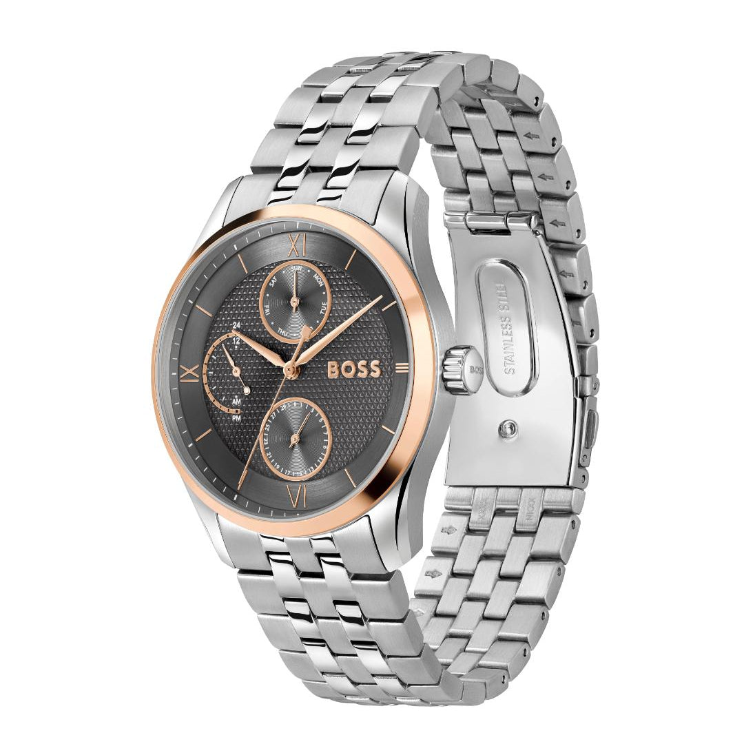 A Hugo Boss men's watch featuring a silver stainless steel link bracelet, a silver case with a rose gold bezel, and a dark gray dial with three sub-dials.