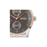 A Hugo Boss wristwatch featuring a textured dark gray dial with rose gold-tone hands, markers, and logo, paired with a silver-tone metal case and link bracelet.