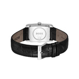 The back view of a HUGO BOSS watch with a black alligator leather strap and a silver-tone rectangular case, showing the engraved BOSS logo on the back.