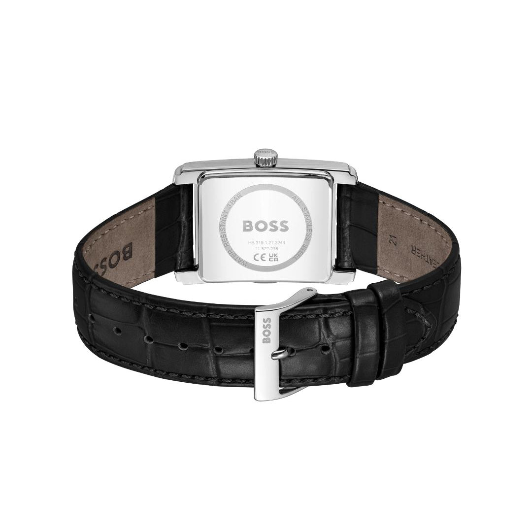 The back view of a HUGO BOSS watch with a black alligator leather strap and a silver-tone rectangular case, showing the engraved BOSS logo on the back.