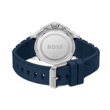 The back view of a HUGO BOSS watch with a navy blue silicone strap and a silver stainless steel case, showing the brushed metal case back engraved with the BOSS logo.
