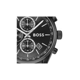Close-up of a Hugo Boss chronograph watch with a black dial, silver-tone hands and markers, and a date window, shown against a plain white background.