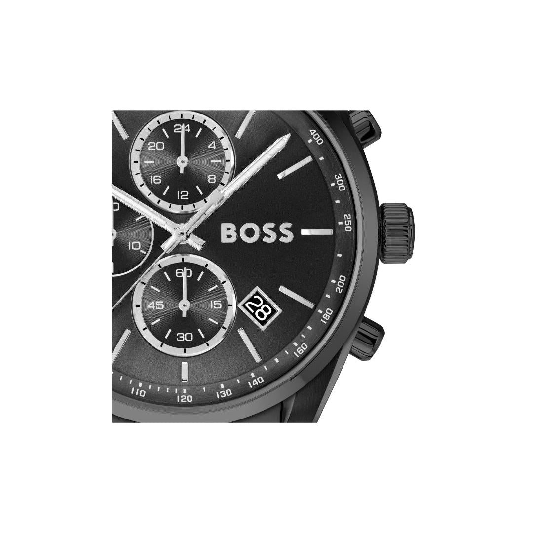 Close-up of a Hugo Boss chronograph watch with a black dial, silver-tone hands and markers, and a date window, shown against a plain white background.