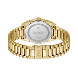 Gold-tone BOSS watch shown from the back, featuring a polished metal link bracelet and a circular case back engraved with the BOSS logo.