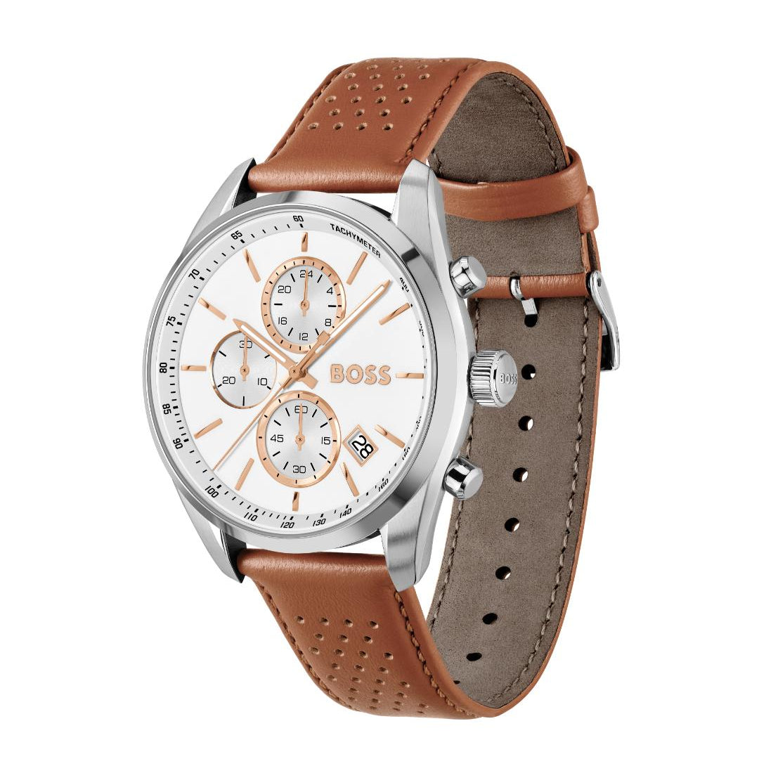A Hugo Boss analog watch with a silver-tone case, white dial with rose-gold accents, and a brown perforated leather strap, shown on a plain white background.