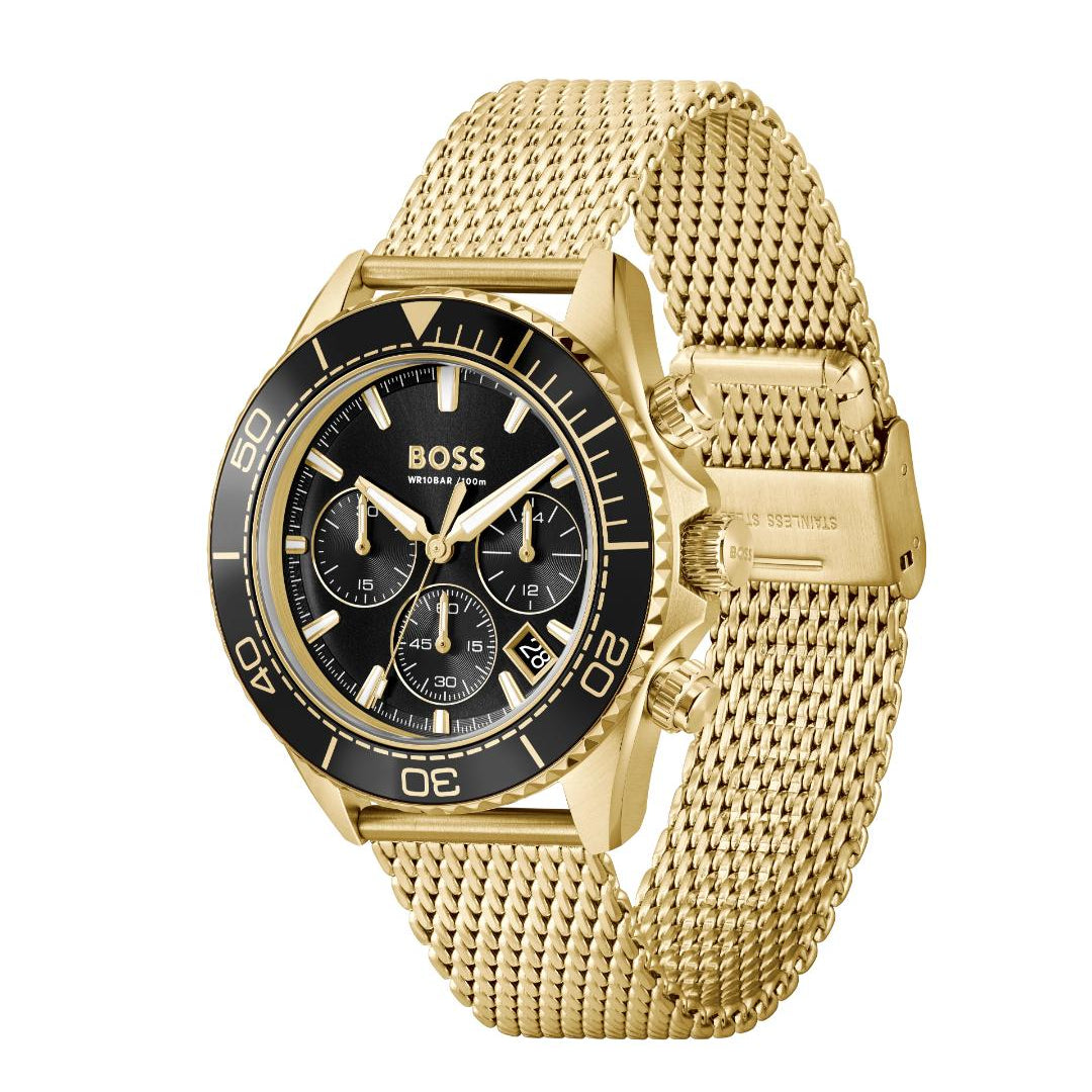 A Hugo Boss wristwatch with a gold-tone mesh strap, gold-tone case, and a black dial with three subdials and a black rotating bezel.