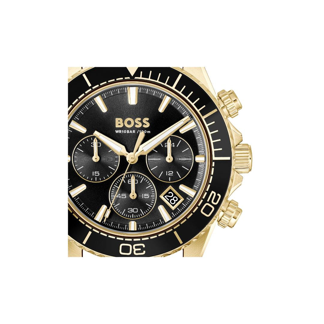 A Hugo Boss wristwatch with a gold-tone case, black dial, and black bezel featuring white markings and a date window.