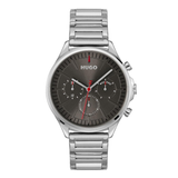 A Hugo watch with a silver stainless steel link bracelet, a round silver case, and a dark gray dial featuring three sub-dials and red accents.