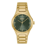 A Hugo wristwatch with a brushed gold-tone stainless steel case and link bracelet, featuring a dark green dial with gold-tone hands and indices.