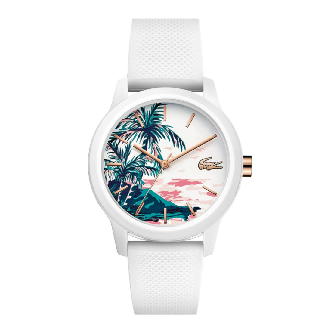 A white Lacoste watch with a textured white strap, featuring a colorful tropical island watch face with palm trees, a pink sky, and rose gold-tone hands and crown.