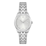 A silver-tone stainless steel wrist watch with a matching link bracelet, featuring a white dial with a Roman numeral XII, crystal hour markers, and a small Lacoste crocodile logo at the 3 o'clock position.