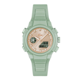 A Casio watch with a light sage green silicone strap and case, featuring a textured rose gold dial with white markings and a digital display.