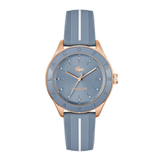 Lacoste watch with a dusty blue dial and a matching blue ribbed silicone strap featuring a white center stripe, framed in rose gold.