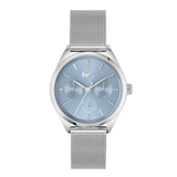A silver-tone Lacoste watch with a light blue dial and a matching silver mesh strap, shown against a plain white background.