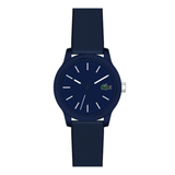 A Lacoste watch with a dark navy blue case, matching textured dial, and a dark navy blue silicone strap, featuring white stick indices and hands, and the signature crocodile logo on the dial.