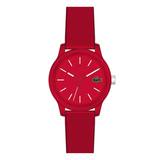 A red Lacoste watch with a textured silicone strap, a matching red dial, and white hands and indices, shown against a plain white background.