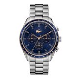 Lacoste stainless steel chronograph watch with a deep blue dial, blue bezel, and rose gold-tone accents, shown on a clean white background.