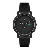 A black Lacoste chronograph watch with a textured silicone strap, black dial, and the signature green crocodile logo at 3 o'clock, shown against a plain white background.