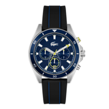 A Lacoste chronograph watch with a blue textured dial, silver-tone stainless steel case, and a black textured rubber strap with blue stripes, shown against a plain white background.