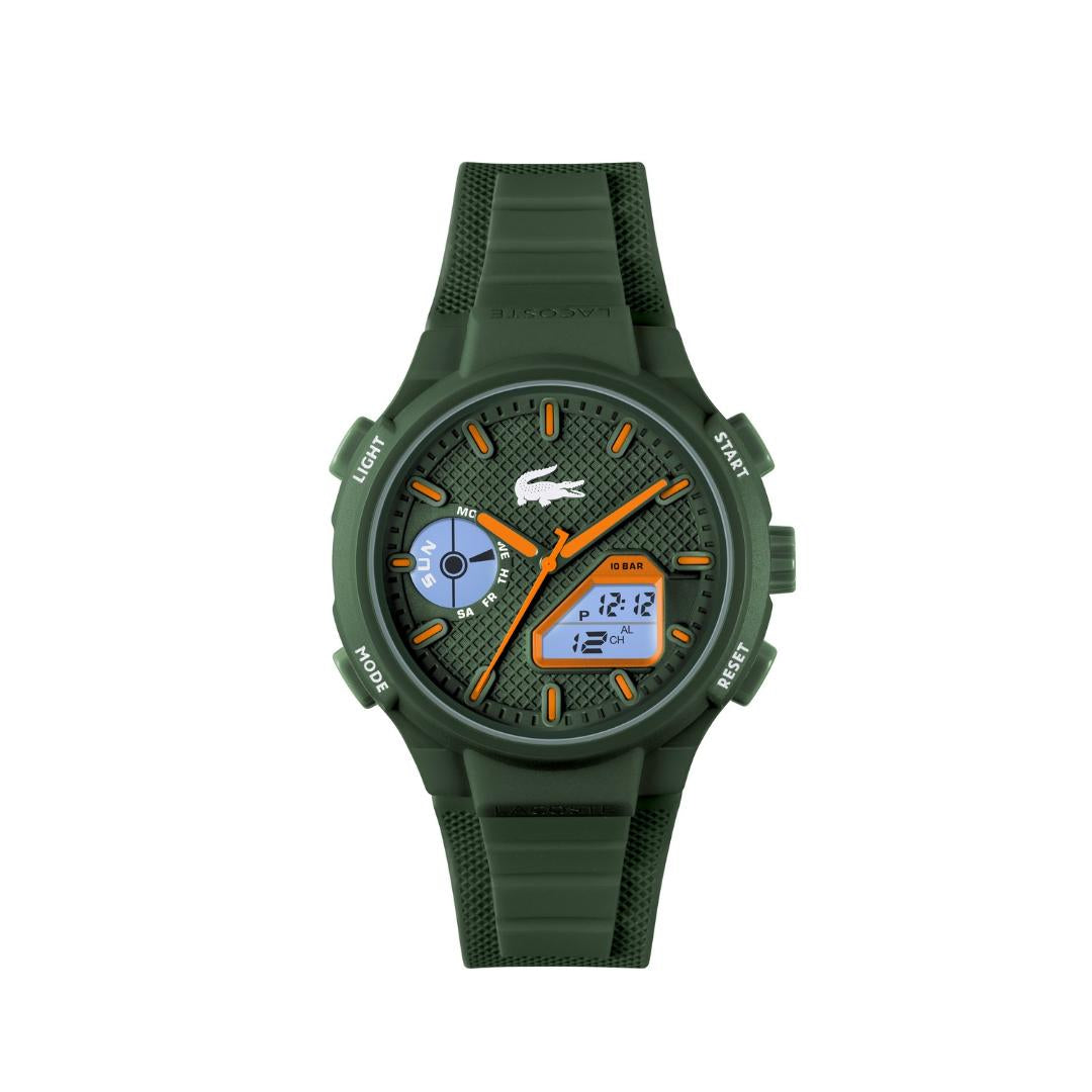 A green digital watch with a textured dial, featuring orange hands, a blue sub-dial, and a green silicone strap, shown against a plain white background.