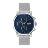 A silver-tone Lacoste chronograph watch with a navy blue dial and a matching silver mesh strap, shown against a plain white background.
