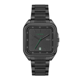 A black rectangular Lacoste watch with a matching black metal link bracelet, featuring a textured black dial, green hands and markers, and a date window at 3 o'clock.