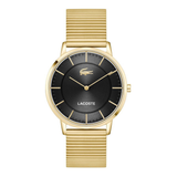 A Lacoste watch with a gold-tone metal case and textured metal bracelet, featuring a black dial with gold-tone hands, hour markers, and the iconic crocodile logo.