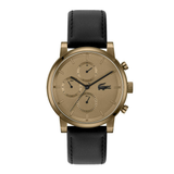 A luxury watch by Lacoste featuring a round bronze-toned case, a champagne-gold dial with three sub-dials, and a black leather strap, shown against a plain white background.