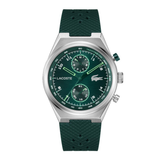 Lacoste chronograph watch with a silver-tone case, green dial, and textured dark green rubber strap, shown on a plain white background.