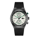 Lacoste chronograph watch with a black textured silicone strap, dark gray metal case, and a white dial with green accents.