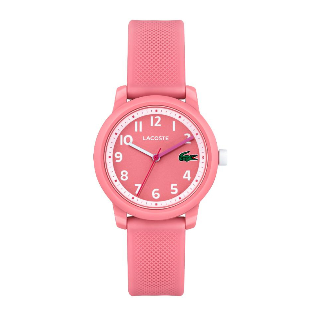 A pink Lacoste analog watch with a textured silicone strap, a pink dial with white Arabic numerals, and a small green crocodile logo at the 3 o'clock position.