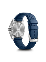 Swiss Pilot wristwatch shown from the back, featuring a silver stainless steel case and a dark blue silicone strap with a silver buckle.