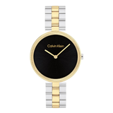 Calvin Klein watch with black face, gold bezel, and two-tone metal band on white background