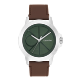 Calvin Klein analog watch with a brown leather strap, a silver-tone case, and a dark green dial featuring the brand's signature 'CK' logo.