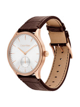 Calvin Klein watch with a white dial, rose gold case, and brown leather strap, shown on a clean white background.
