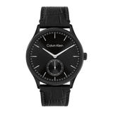 Calvin Klein black watch with a black dial, black textured strap, and silver-tone hands and indices, shown on a plain white background.