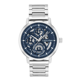 Calvin Klein skeleton watch with a silver stainless steel link bracelet and a dark blue dial showing the inner mechanical movement.