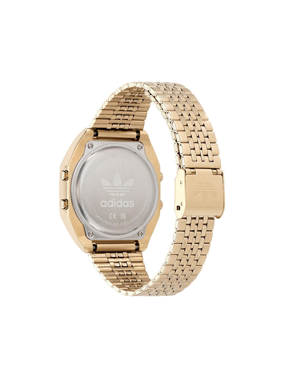 The back view of an Adidas watch with a gold-tone metal case and a matching gold-tone mesh link band, set against a plain white background.