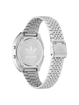 Silver stainless steel watch with a metal link band, shown from the back to reveal the branded case back and clasp on a white background.