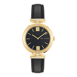 Ted Baker watch with black strap and gold casing on a white background