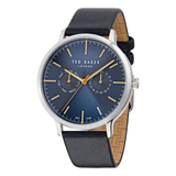 Ted Baker men’s chronograph wrist watch with a 42 mm round blue dial, rose gold-tone numeral markers, three subdials, angled date window, silver and rose gold case, and blue genuine leather strap displayed on a white background.
