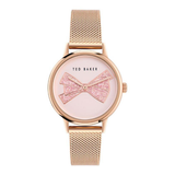 Rose gold watch with a white face on a white background