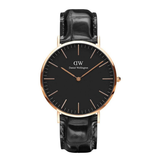 Daniel Wellington watch with black face and leather strap on a white background