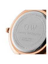 Back view of a Daniel Wellington watch with branding and serial number.