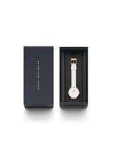 Watch in a black box with 'Daniel Wellington' branding on a white background