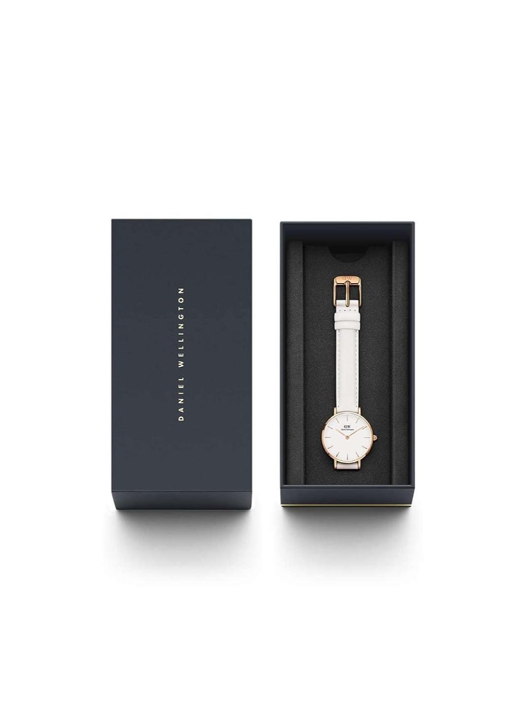 Watch in a black box with 'Daniel Wellington' branding on a white background