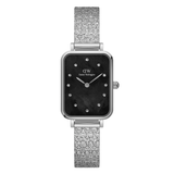 Silver watch with black face and glittery band on a white background